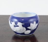 A Chinese blue and white porcelain bird feeder, 19th century, the unglazed biscuit moulded