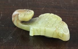 A Chinese greenish-yellow jade belt hook, 17th century or earlier, carved with archaistic scrolls