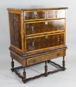 A William and Mary oyster veneered chest on stand, with interlaced boxwood inlay, on a later stand