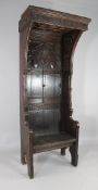 A 19th century carved oak gothic Bishop`s chair, W.2ft 8in. H.6ft 8in.