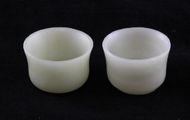 A pair of Chinese pale celadon jade cups, approx 2.1in.