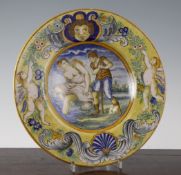 An Italian Urbino style maiolica dish, late 19th century, the centre painted with a semi-nude