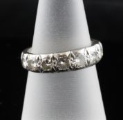 An 18ct white gold and diamond half eternity ring, set with nine graduated stones, size M.