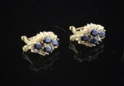 A pair of 14ct gold sapphire and diamond cluster set ear clips.