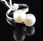 A French 18ct white gold, diamond and baroque pearl crossover ring, size O.