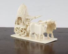 A 19th century Indian John Company ivory figure group, modelled as a carriage pulled by two oxen,