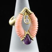 A modern 18ct two colour gold, carved coral, diamond and amethyst set dress ring, by David Morris,