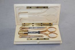 A 19th century French ivory cased 18ct gold and gold mounted five piece necessaire, of rectangular