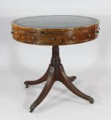 A small Regency mahogany circular drum table, with four frieze drawers and dummy drawers, on