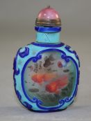 A Chinese two colour overlaid and inside painted glass snuff bottle, decorated with ornamental