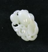 A Chinese pale celadon jade carving of bitter melons and leaves, the stone with brown inclusions,
