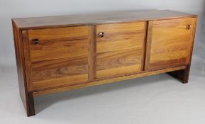 A 1970`s Danish teak and rosewood sideboard, fitted with three sliding doors, W.5ft 11in.