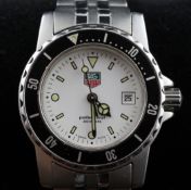 A lady`s stainless steel Tag Heuer Professional quartz wrist watch, with rotating bezel and white