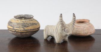 Three items of Indus Valley pottery, c.3,300-1,300 B.C., comprising the figure of a bull, 3.5in.,