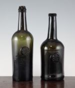 Two All Saints Common Room sealed olive green glass wine bottles, the first mallet shaped c.1760,