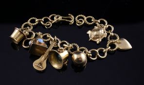 A middle eastern gold charm bracelet, hung with seven gold charms, unmarked, gross 35.3 grams.
