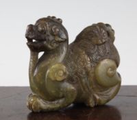 A Chinese green soapstone recumbent figure of a mythical beast, 19th century, 4.5in.
