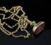 A 19th century gold and carnelian set fob seal, the oval stone matrix carved with shield shaped