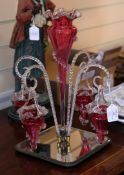 A Victorian cranberry glass epergne, with clear frill work decoration, comprising a central