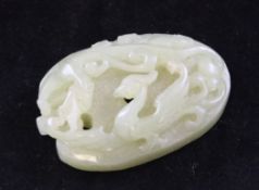 A Chinese green jade phoenix and chi-dragon mount, 19th century, approx. 2.1in.