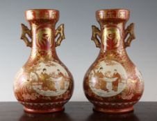 A pair of Japanese Kutani porcelain baluster vases, Meiji period, each painted with figures in a