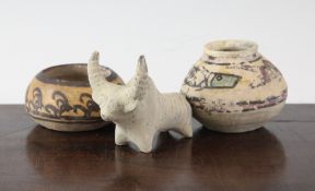 Three items of Indus Valley pottery, c.3,300-1,300 B.C. comprising the figure of a bull, 3.75in.,