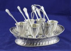 A Victorian novelty silver egg cruet, by Robert Hennell III, modelled as a basket with simulated