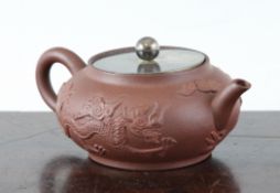 A Chinese Yixing pottery teapot, 17th / 18th century, with sprigged decoration of two dragons