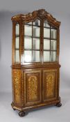 A 19th century Dutch marquetry inlaid display cabinet, with two glazed doors and two cupboard doors,
