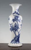 A Chinese blue and white slender baluster vase, Kangxi mark but later, painted with peonies and