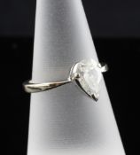 An 18ct white gold solitaire diamond ring, the pear shaped stone weighing approximately 1.15ct, size