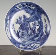 A Chinese blue and white dish, Qianlong mark but later, painted with ladies gathering cherries,
