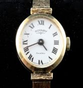 A lady`s late 1960`s 9ct gold Rotary wrist watch, with oval Roman dial, on chased 9ct gold