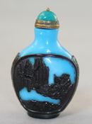 A Chinese amethyst and blue overlaid glass snuff bottle, Qianlong seal mark but later, carved in