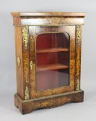 A Victorian walnut and marquetry inlaid pier cabinet, with gilt brass mounts and single glazed door,