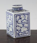 A Chinese blue and white moulded tea caddy, 18th / 19th century, decorated with lotus, 4.5in.