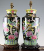 A pair of Oriental famille noire table lamps decorated with birds and flowers, 15in.