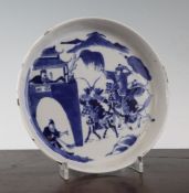 A Chinese blue and white dish, painted with soldiers on horseback approaching a gate, four character