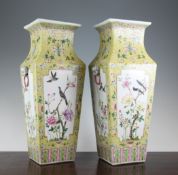 A pair of Chinese famille rose square baluster vases, Qianlong seal mark but later, each with panels