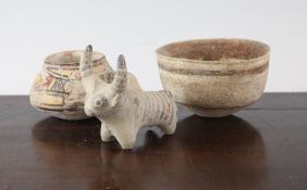 Three items of Indus Valley pottery, C.3300-1300 B.C., comprising a figure of a bull, 3.5in., a