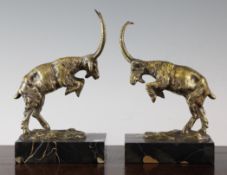 A pair of 20th century figural bookends, modelled as rearing mountain goats on marble bases, 9in.