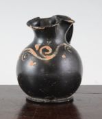 A Greek Xenon ware oinochoe, Greek, c.4th century B.C., with red slip scroll decoration to the