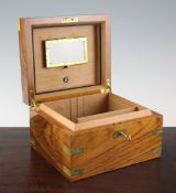 A Dunhill brass mounted figured walnut humidor, containing a selection of cigars including