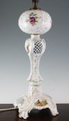 A Potschappel porcelain oil lamp base, the globular reservoir painted with flowers, the stem and