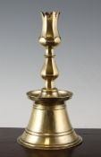 An Ottoman brass tulip candlestick, Turkish 17th / 18th century, with conical base, deep drip tray