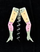 A German novelty `lady`s legs` corkscrew, with celluloid pink striped stocking and flesh coloured