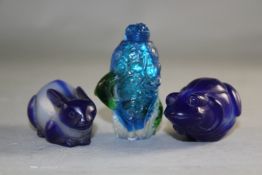 Three Chinese moulded overlaid glass snuff bottles, in the form of a rabbit, a frog and a bird by