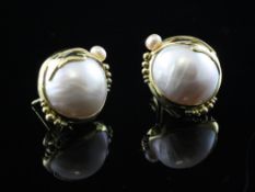 A pair of 18ct gold, mabe and cultured pearl ear clips, with stylised leaf and berry decoration.