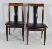 A set of six 1960`s Danish rosewood dining chairs, with black leather effect padded splats and