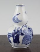 A Chinese small blue and white gourd shaped bottle vase, Kangxi mark but late 19th century,